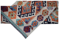 A handwoven Afghan Maimana wool runner featuring a colorful geometric pattern on a cream background.