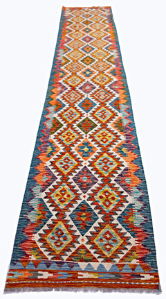 Handwoven Afghan Maimana wool runner featuring a vibrant, multicolored geometric diamond pattern.