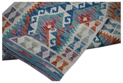 Handwoven Afghan Maimana kilim runner featuring a geometric pattern in vibrant multicolored wool.