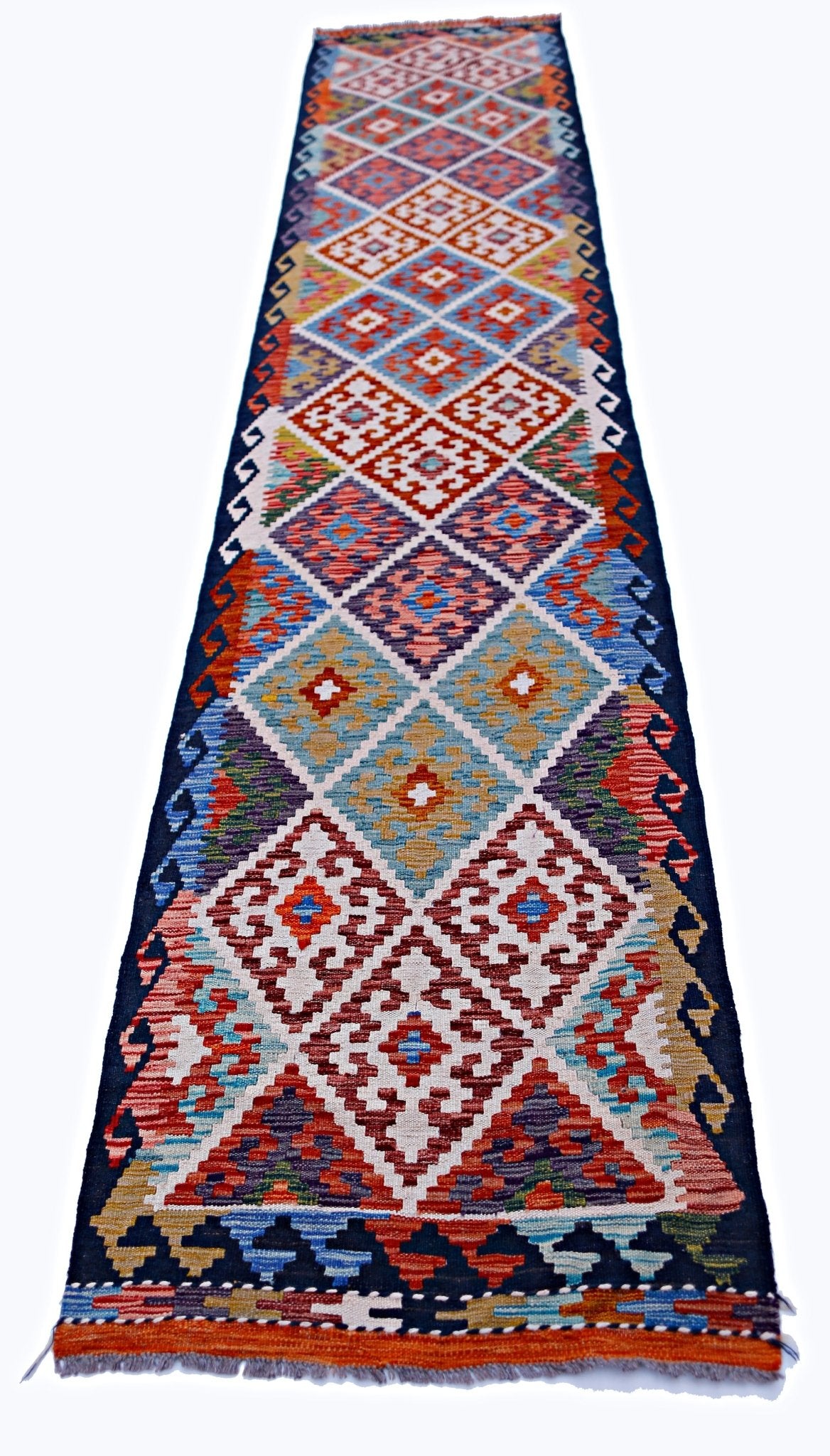 Handwoven Afghan Maimana wool runner featuring a colorful geometric diamond pattern.