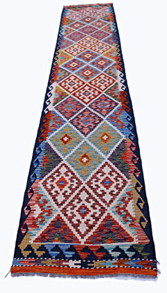 Handwoven Afghan Maimana wool runner featuring a colorful geometric diamond pattern.