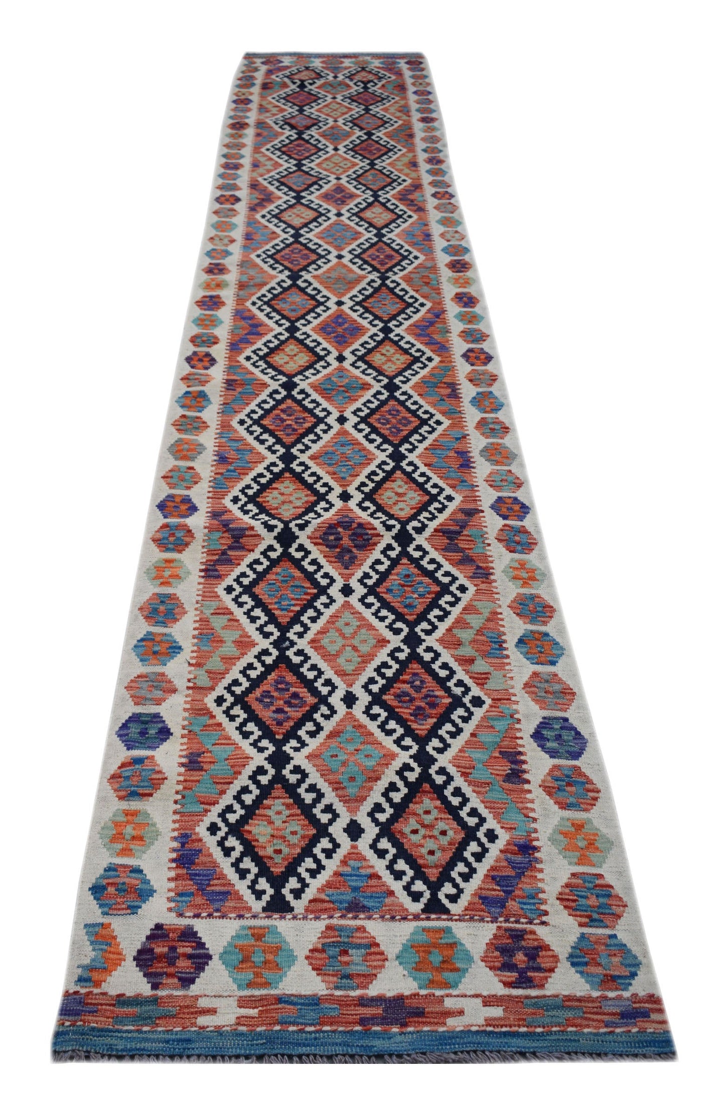 A long, handmade Afghan Maimana kilim runner featuring a vibrant geometric diamond pattern.