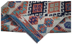 Handwoven Afghan Maimana kilim runner featuring geometric patterns in vibrant wool colors.