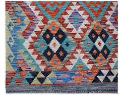 Handwoven Afghan Maimana wool runner featuring a vibrant geometric diamond pattern.