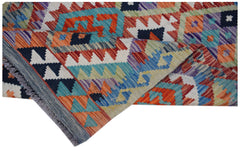 A handwoven Afghan Maimana wool runner featuring a vibrant geometric pattern in a flatweave style.