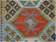 A handmade Afghan Maimana kilim runner featuring a geometric pattern in orange, green, and grey.