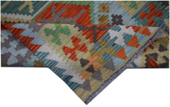 A handmade Afghan Maimana Kilim runner featuring a colorful geometric pattern in wool.