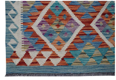 Handwoven Afghan Maimana wool kilim runner featuring a colorful geometric diamond pattern.