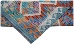 A handmade Afghan Maimana kilim runner featuring a vibrant geometric pattern in wool.