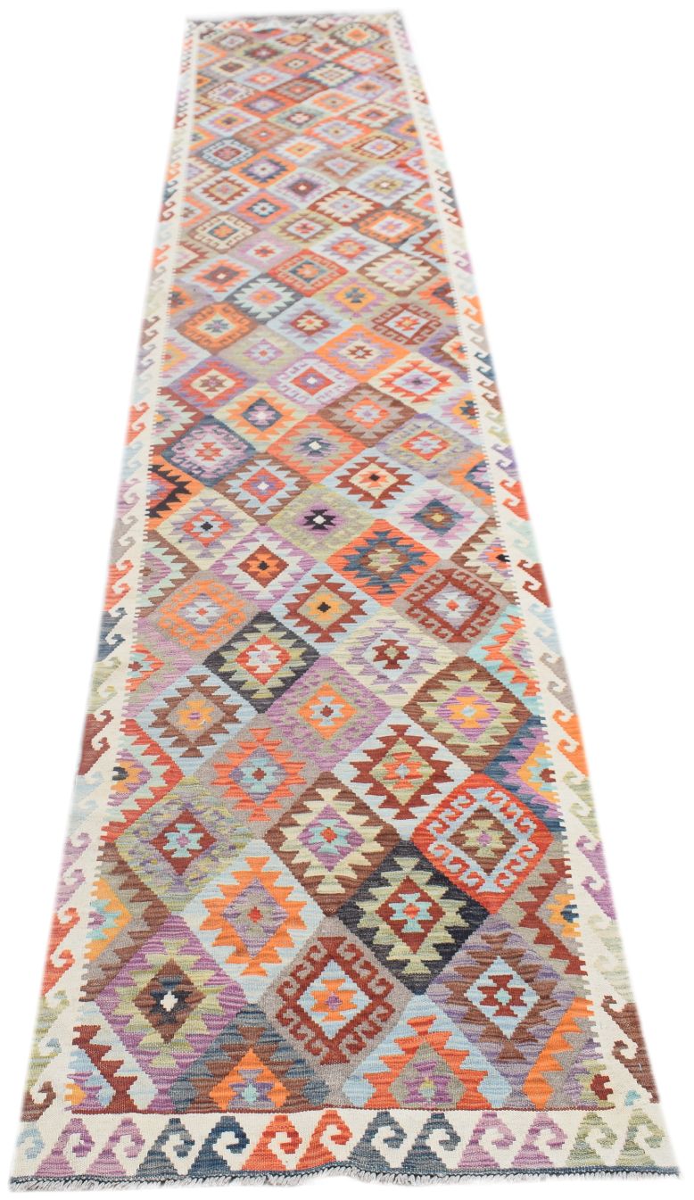 Handmade Afghan Maimana wool runner rug featuring a colorful geometric diamond pattern.