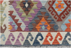 Handmade Afghan Maimana kilim runner featuring a colorful geometric pattern on a cream background.