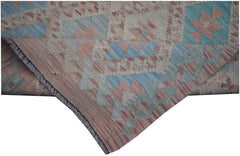 A handmade Afghan Maimana kilim runner featuring a geometric pattern in soft blue and pink tones.