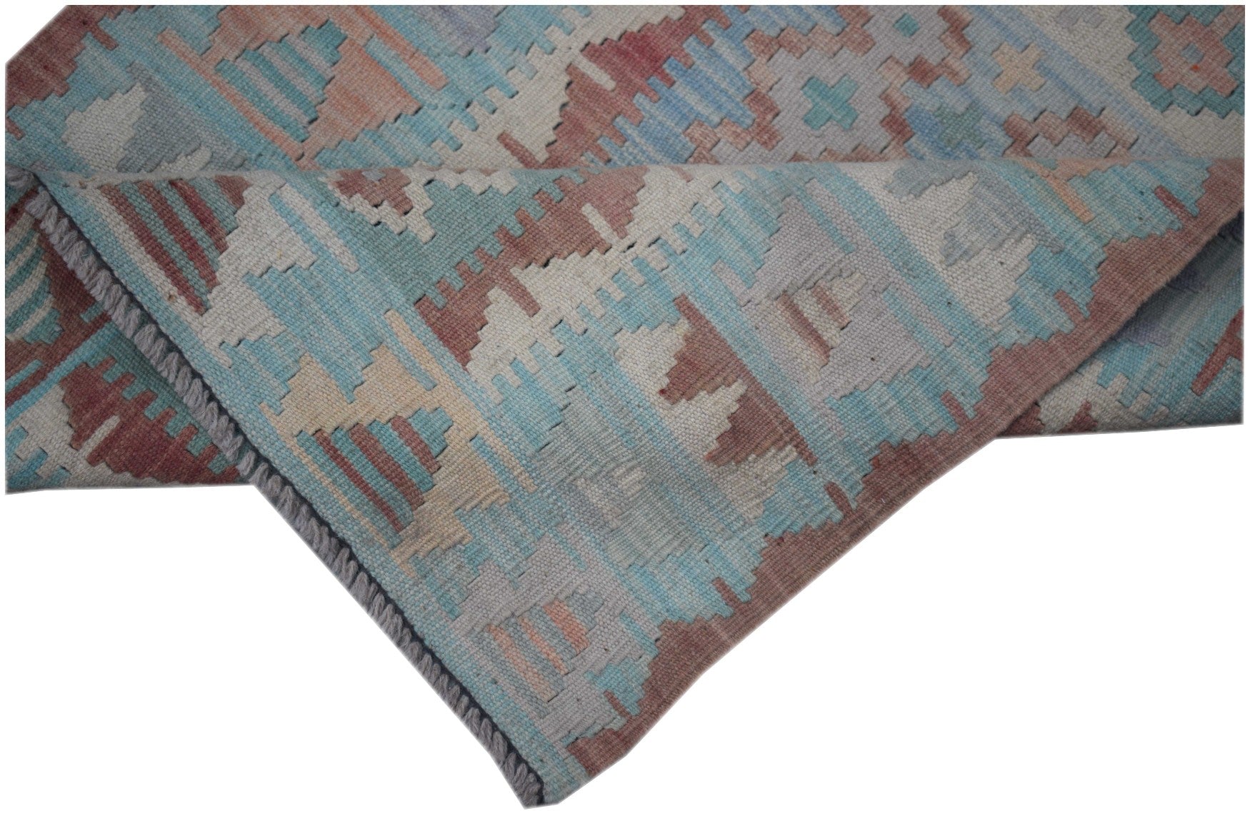 A handmade Afghan Maimana Kilim runner featuring a geometric pattern in blue, red, and beige.