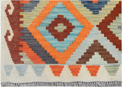 Handmade Afghan Maimana kilim runner featuring a geometric pattern in orange, blue, and brown.
