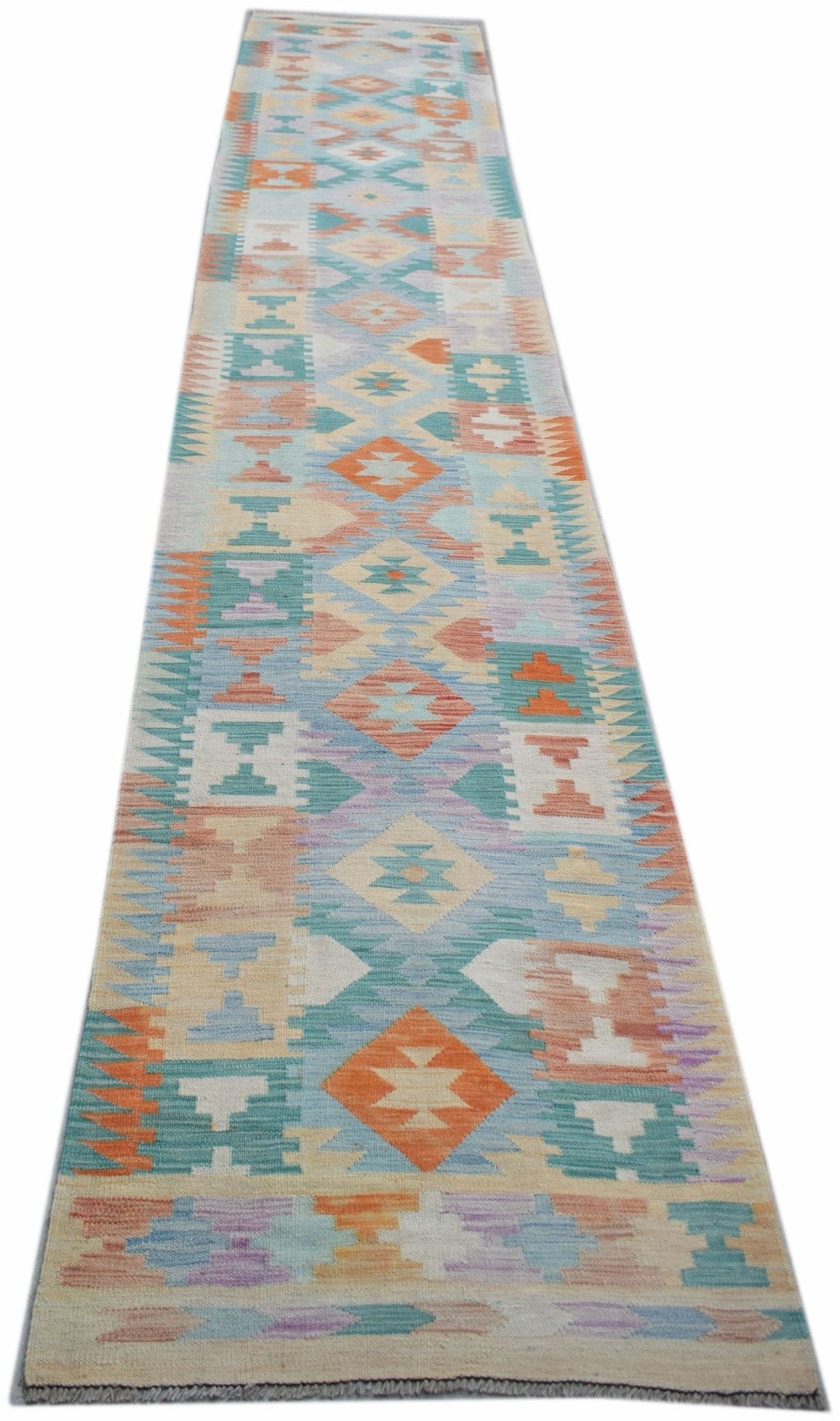 Handwoven Afghan Maimana wool runner featuring a colorful geometric pattern on a flatweave texture.