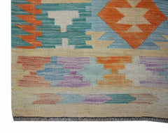 Handwoven Afghan Maimana kilim runner featuring a geometric pattern in vibrant multicolored wool.