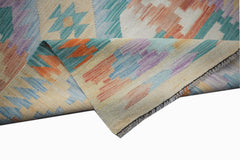 A handmade Afghan Maimana wool kilim runner featuring a colorful geometric pattern.