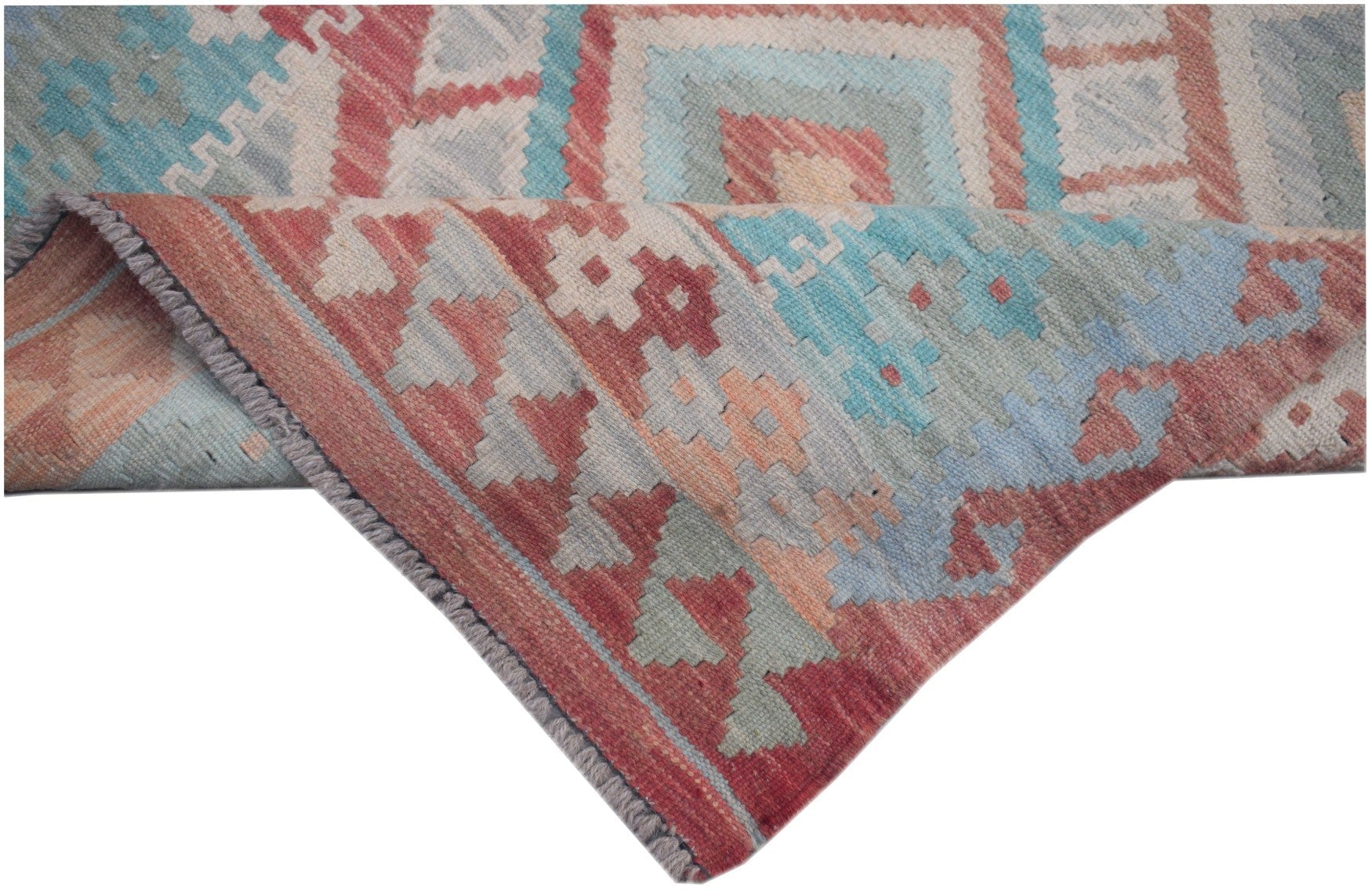 A handmade Afghan Maimana kilim runner featuring geometric patterns in red, blue, and cream wool.