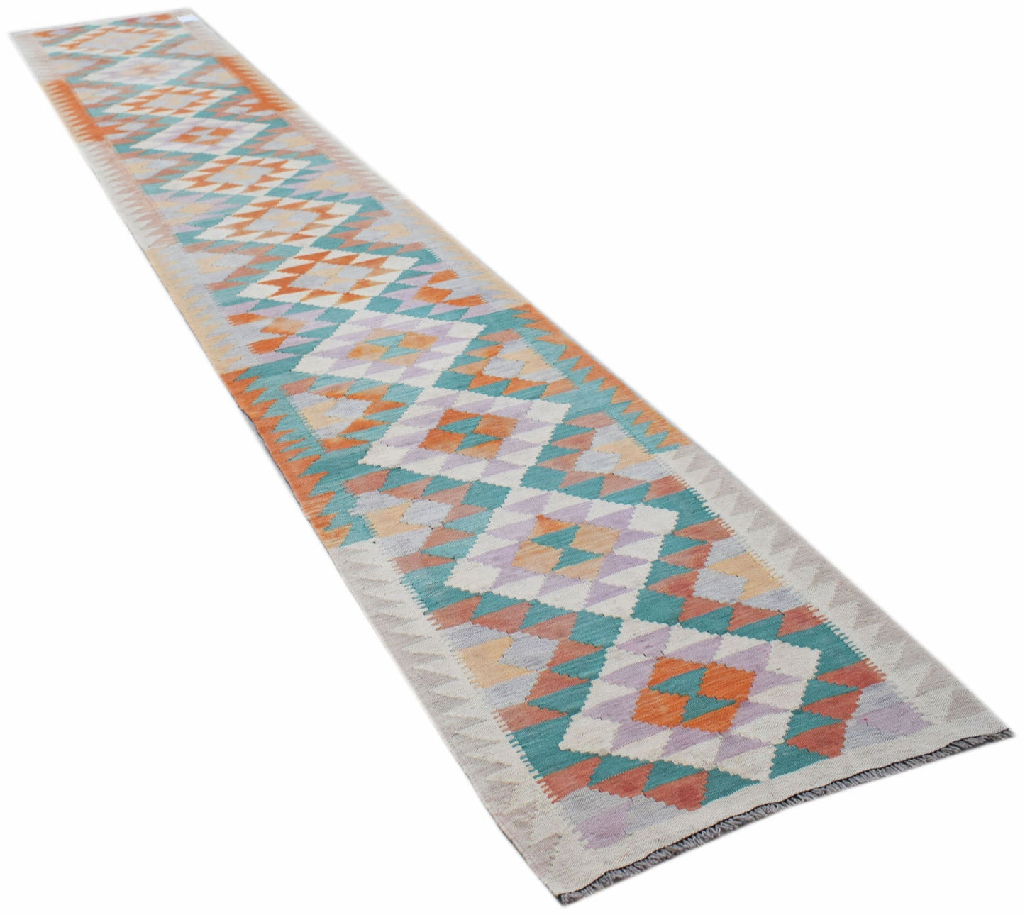 A long, handmade Afghan Maimana wool runner rug featuring a geometric diamond pattern.