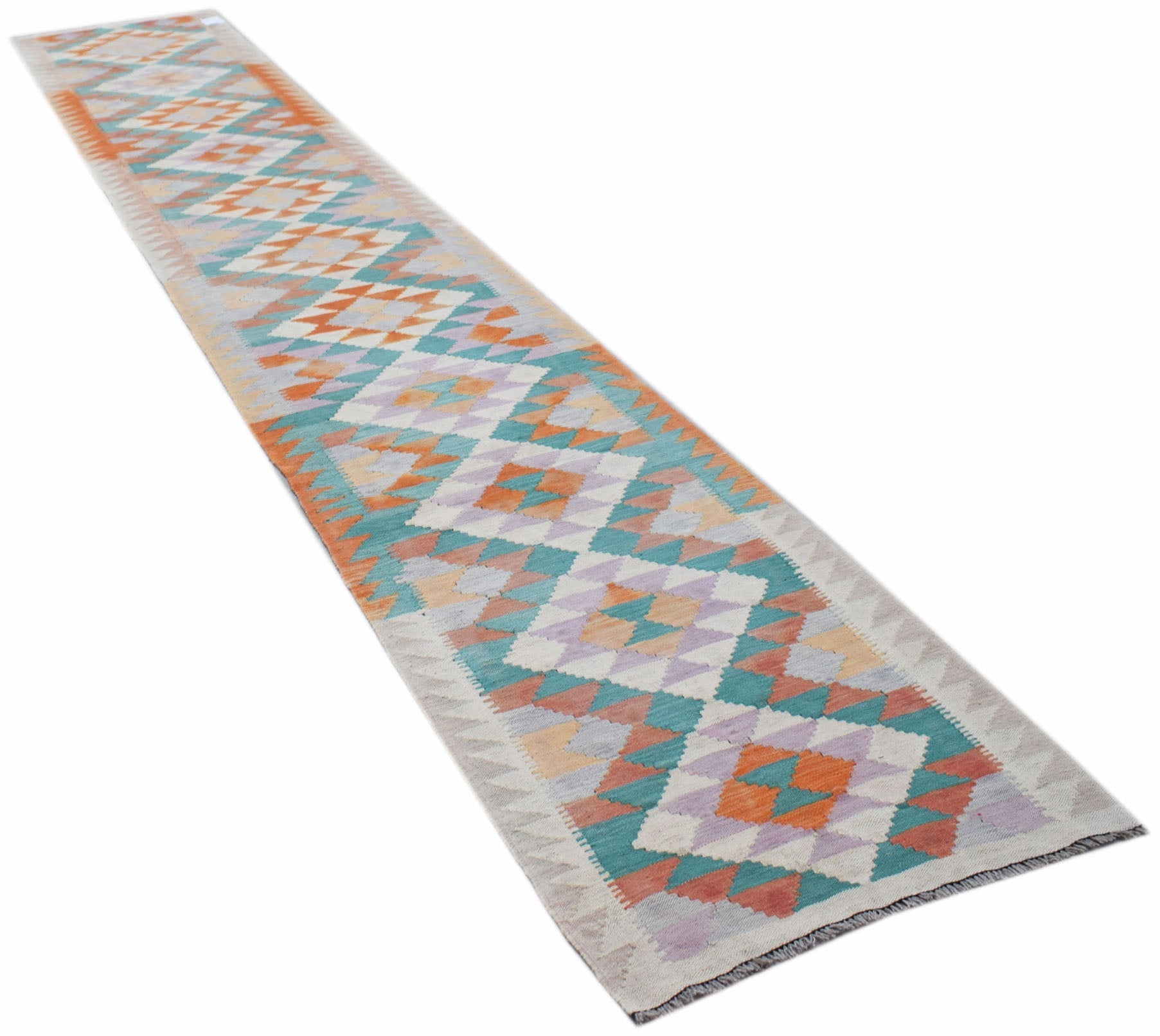 A long, handmade Afghan Maimana wool runner rug featuring a geometric diamond pattern.
