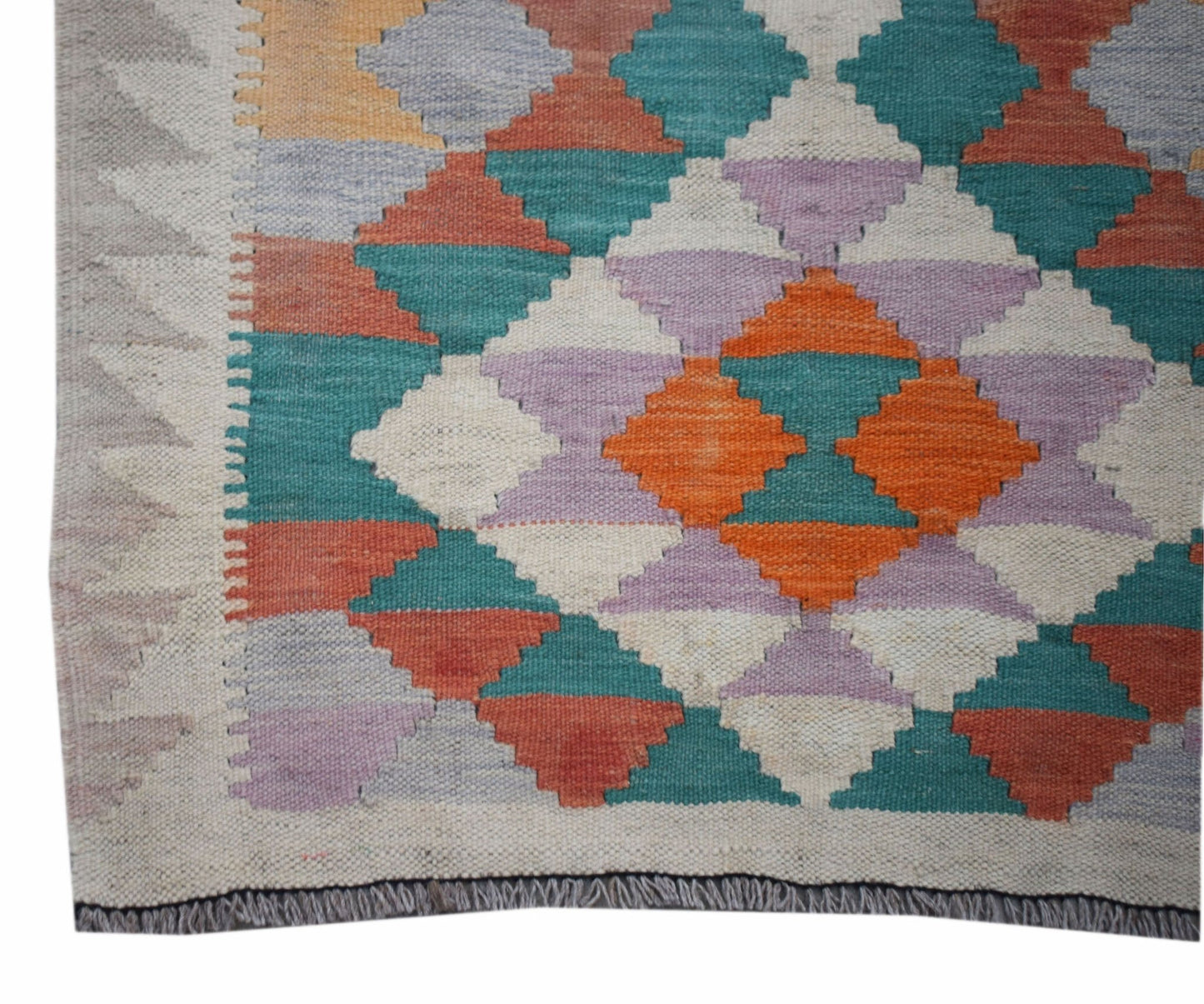 Handwoven Afghan Maimana wool runner featuring a colorful geometric diamond pattern.