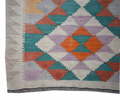 Handwoven Afghan Maimana wool runner featuring a colorful geometric diamond pattern.