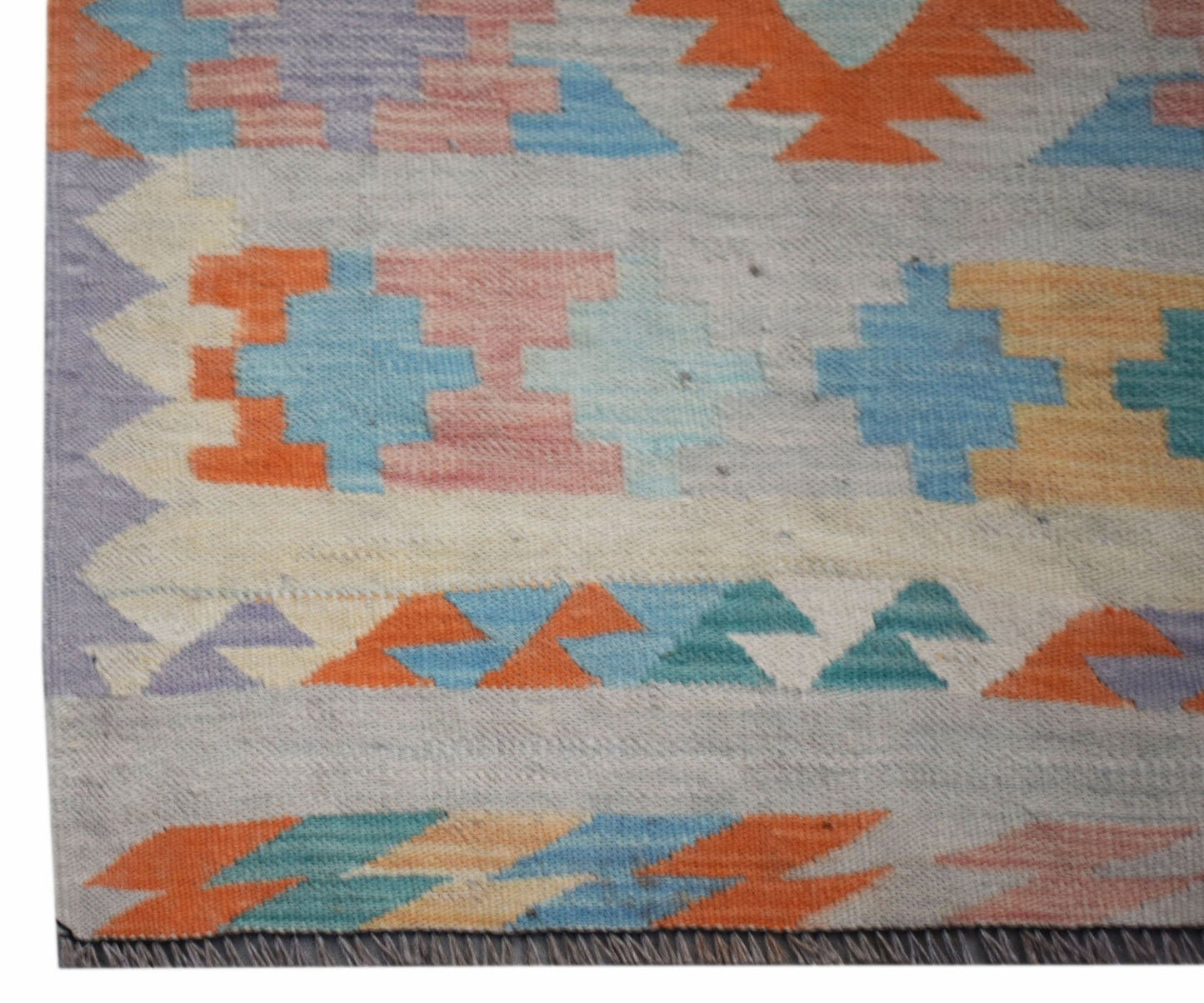 Handwoven Afghan Maimana wool runner featuring a geometric pattern in vibrant multicolored tones.