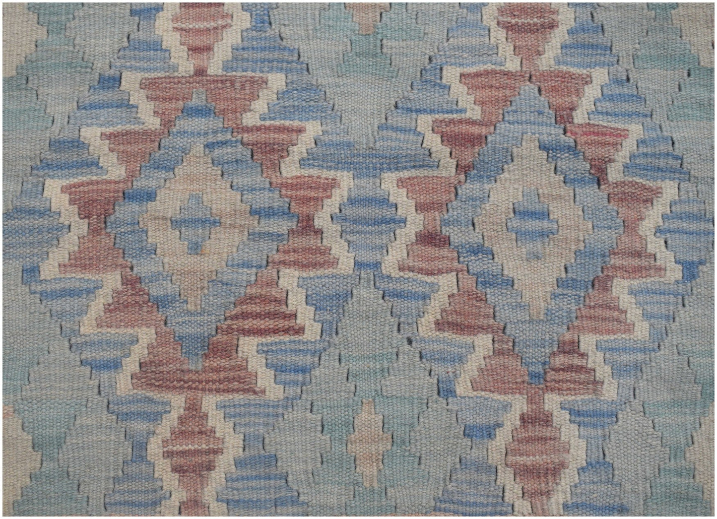 Handwoven Afghan Maimana kilim runner featuring a repeating geometric diamond pattern in blue and red.
