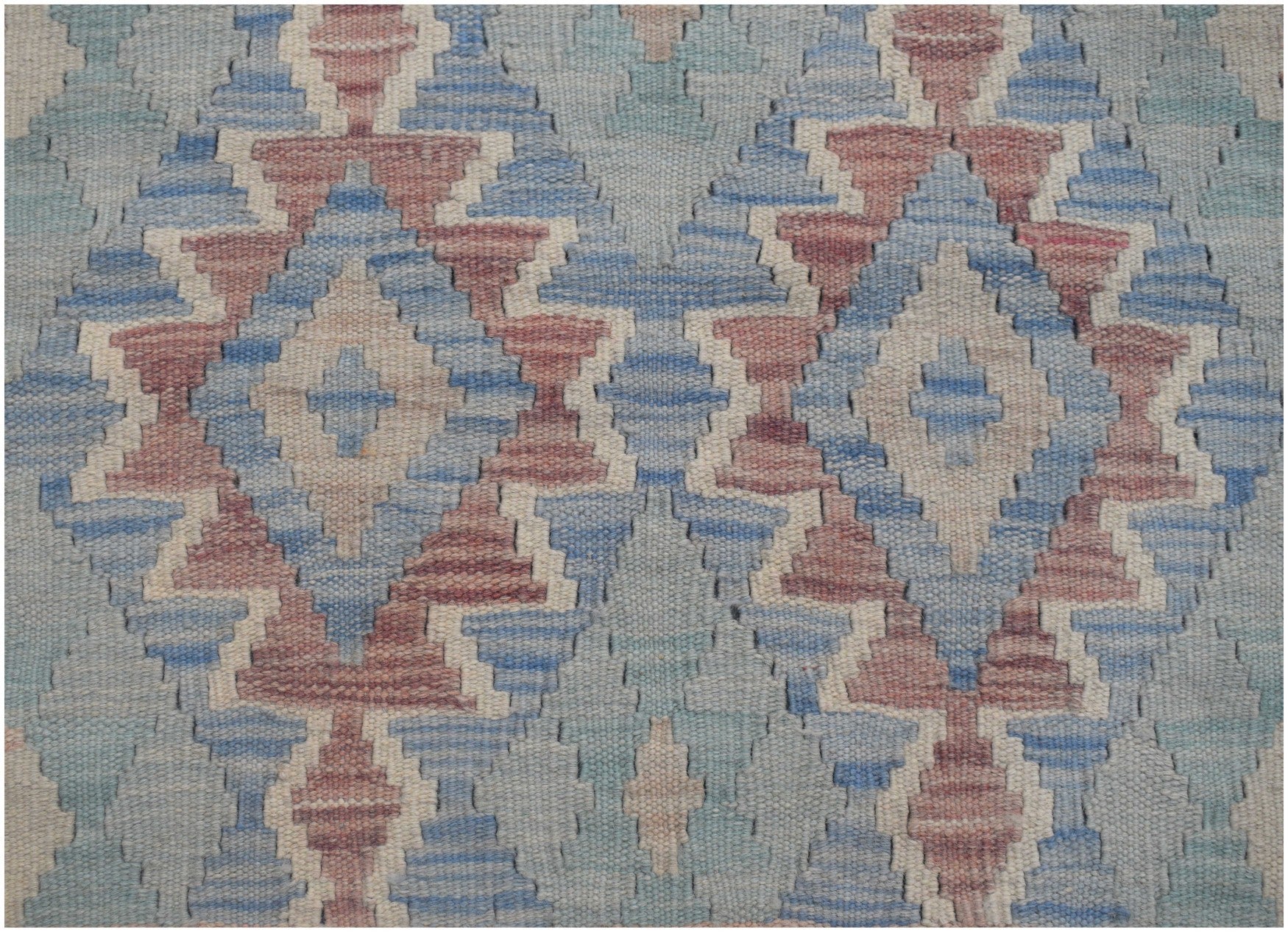 Handwoven Afghan Maimana kilim runner featuring a repeating geometric diamond pattern in blue and red.