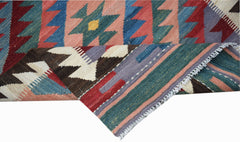 A handmade Afghan Maimana wool kilim runner featuring geometric patterns in vibrant colors.