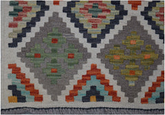 Handwoven Afghan Maimana kilim runner featuring a geometric diamond pattern in earthy tones.