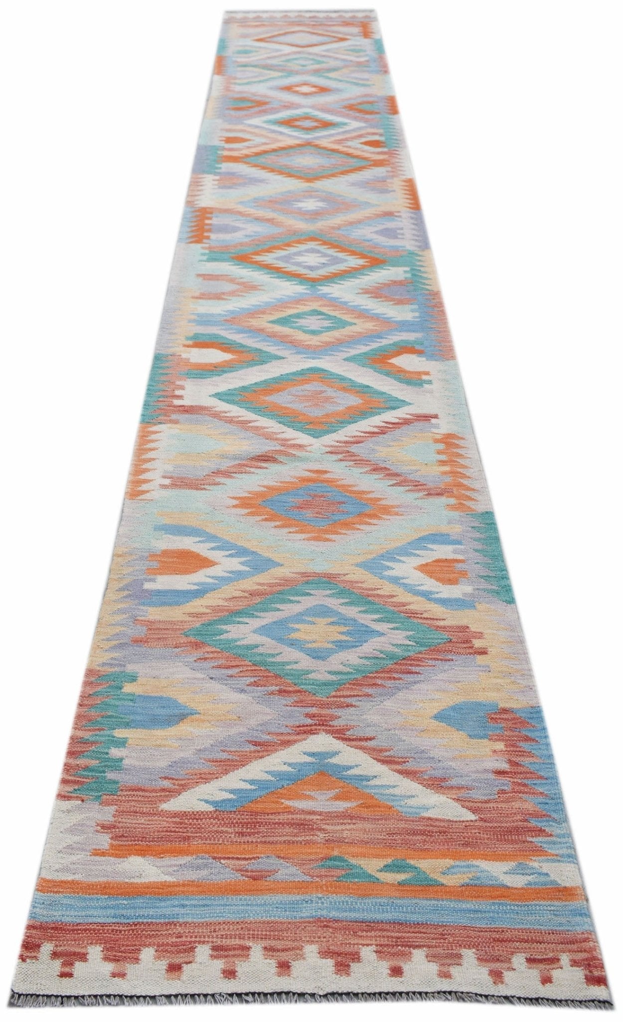 A long, handmade Afghan Maimana wool runner featuring a colorful geometric diamond pattern.