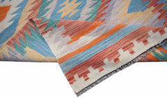 A handwoven Afghan Maimana wool kilim runner featuring a colorful geometric pattern.