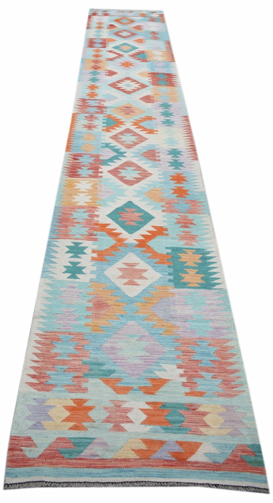 Handwoven Afghan Maimana wool runner rug featuring a colorful geometric pattern.
