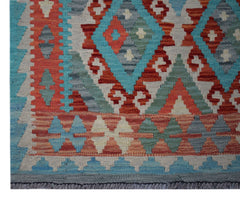 Handwoven Afghan Maimana kilim runner featuring a geometric pattern in vibrant wool colors.
