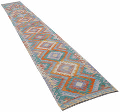 A long, handmade Afghan Maimana Kilim runner featuring a repeating geometric diamond pattern.