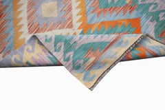 A handmade Afghan Maimana kilim runner featuring a colorful geometric pattern on flatweave wool.