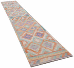 Handwoven Afghan Maimana wool runner rug featuring a geometric diamond pattern in pastel tones.