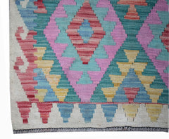 Handwoven Afghan Maimana wool runner featuring a colorful geometric diamond pattern.