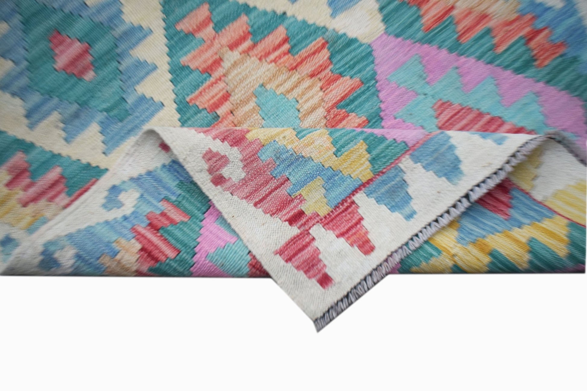 A handmade Afghan Maimana kilim runner featuring a colorful geometric pattern on wool.