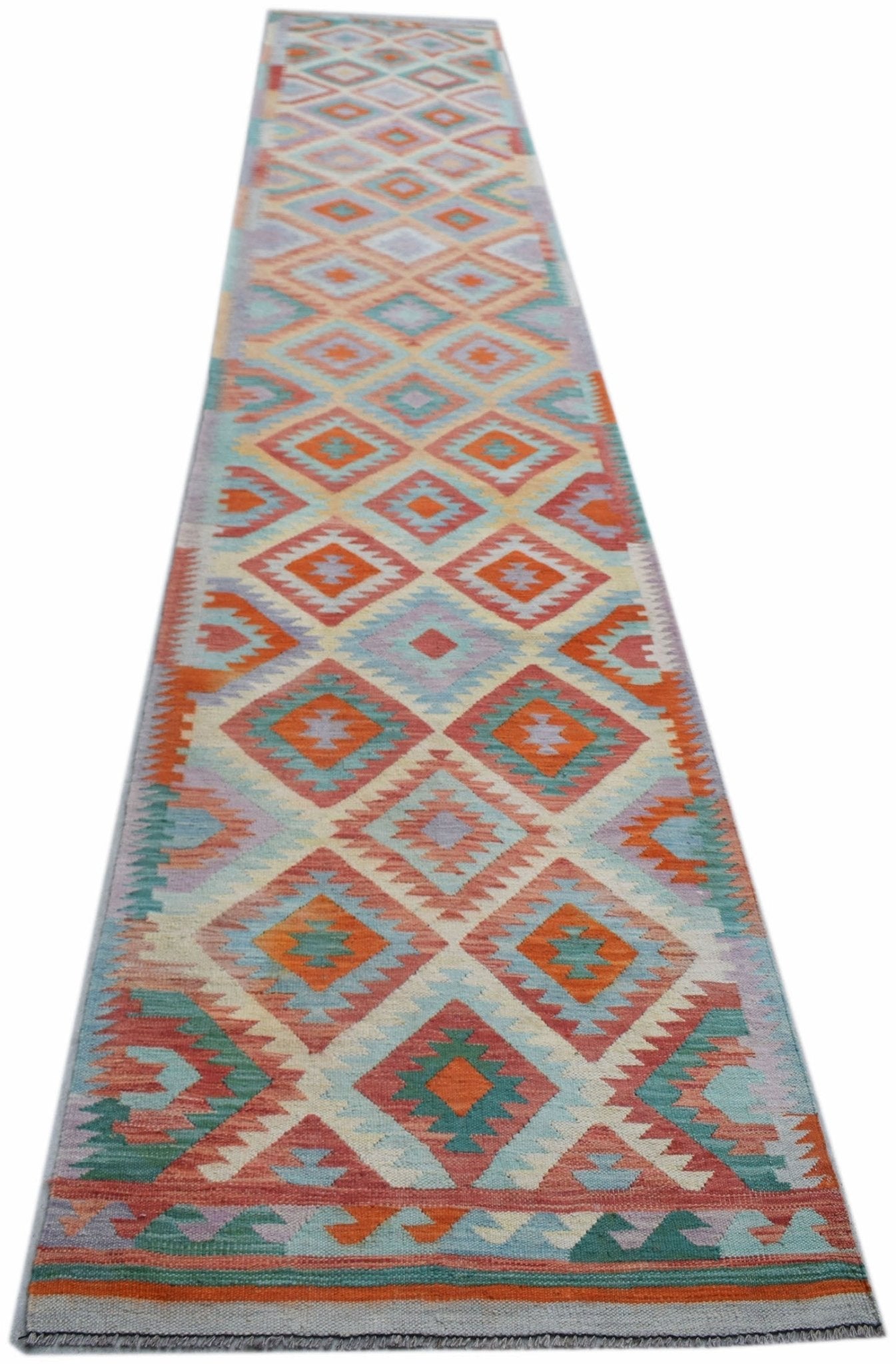 Handwoven Afghan Maimana wool runner featuring a colorful geometric diamond pattern.