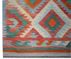 Handwoven Afghan Maimana wool runner featuring a vibrant geometric diamond pattern.