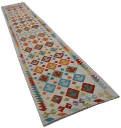 Handwoven Afghan Maimana wool runner rug featuring a colorful geometric diamond pattern.