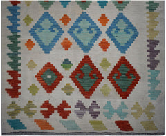 Handwoven Afghan Maimana kilim runner featuring colorful geometric diamond patterns on wool.