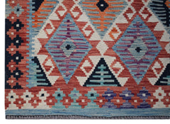 Handwoven Afghan Maimana kilim runner featuring a geometric pattern in red, blue, and purple.