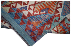 Handwoven Afghan Maimana wool kilim runner featuring a vibrant geometric pattern.