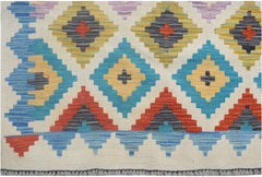 Handmade Afghan Maimana kilim runner featuring a colorful geometric diamond pattern on wool.