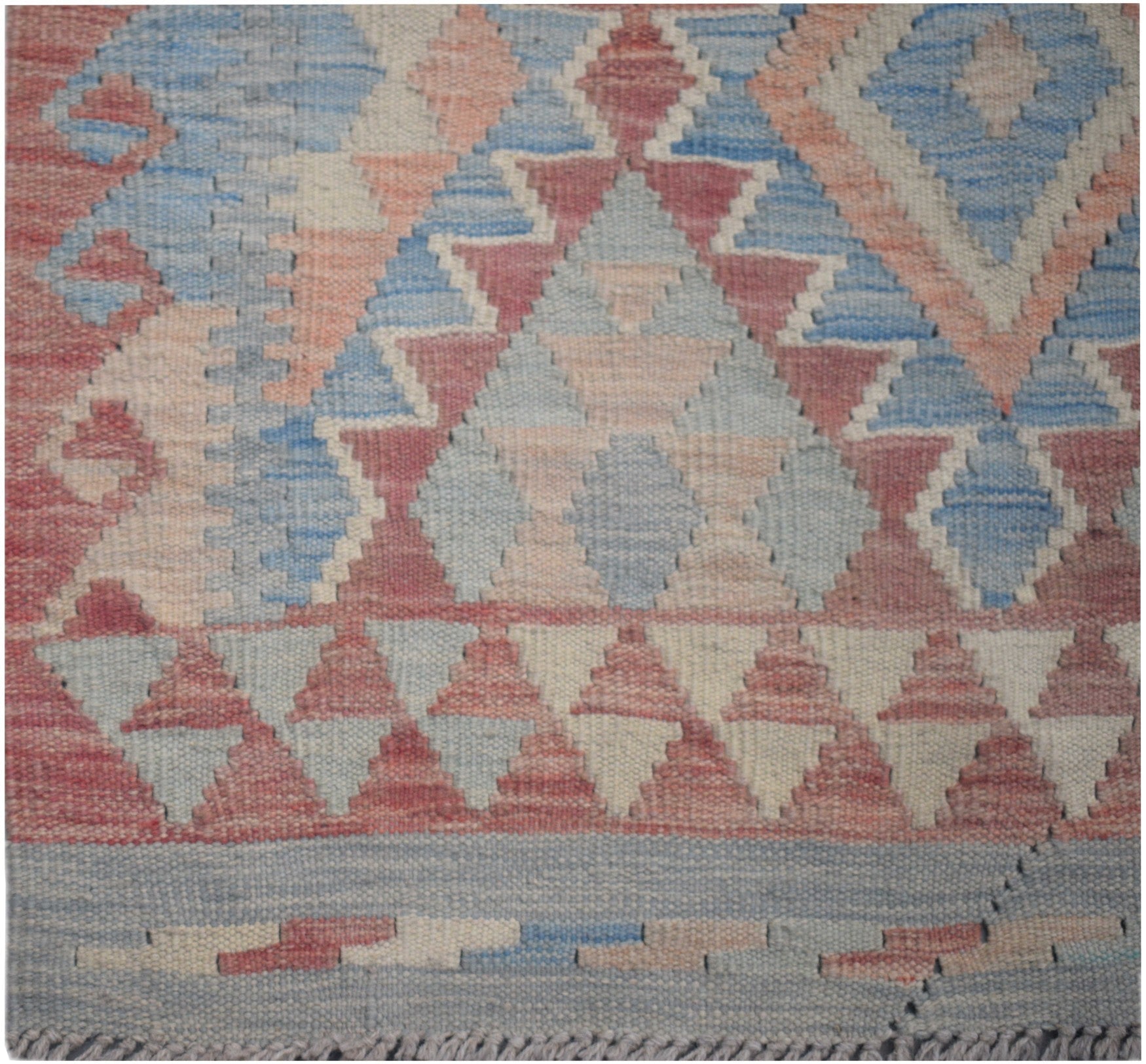 Handmade Afghan Maimana kilim runner featuring a geometric pattern in blue, pink, and cream wool.