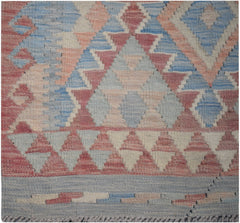 Handmade Afghan Maimana kilim runner featuring a geometric pattern in blue, pink, and cream wool.