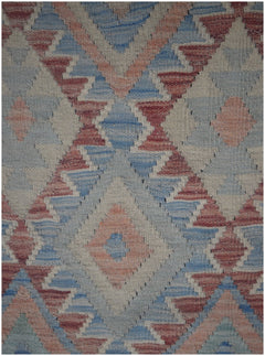 Handmade Afghan Maimana kilim runner featuring a geometric diamond pattern in blue and terracotta.